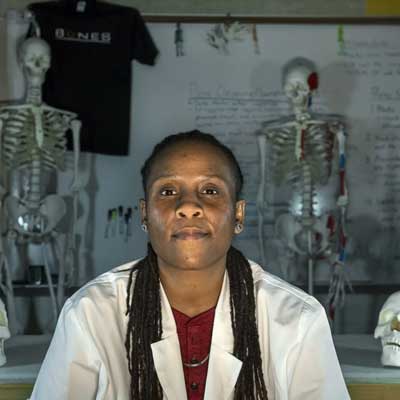 sabrina sims working in a forensic science lab