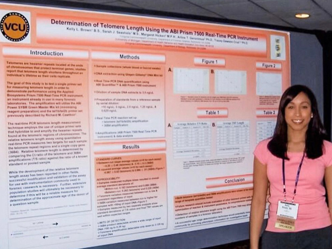 Kelly Knight stands in front of a research poster